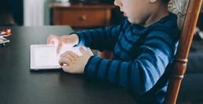 Kid playing with tablet